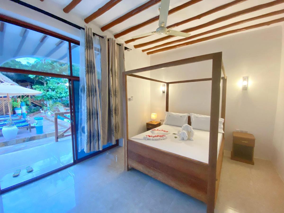 Utulivu Bungalow Нунгви Экстерьер фото