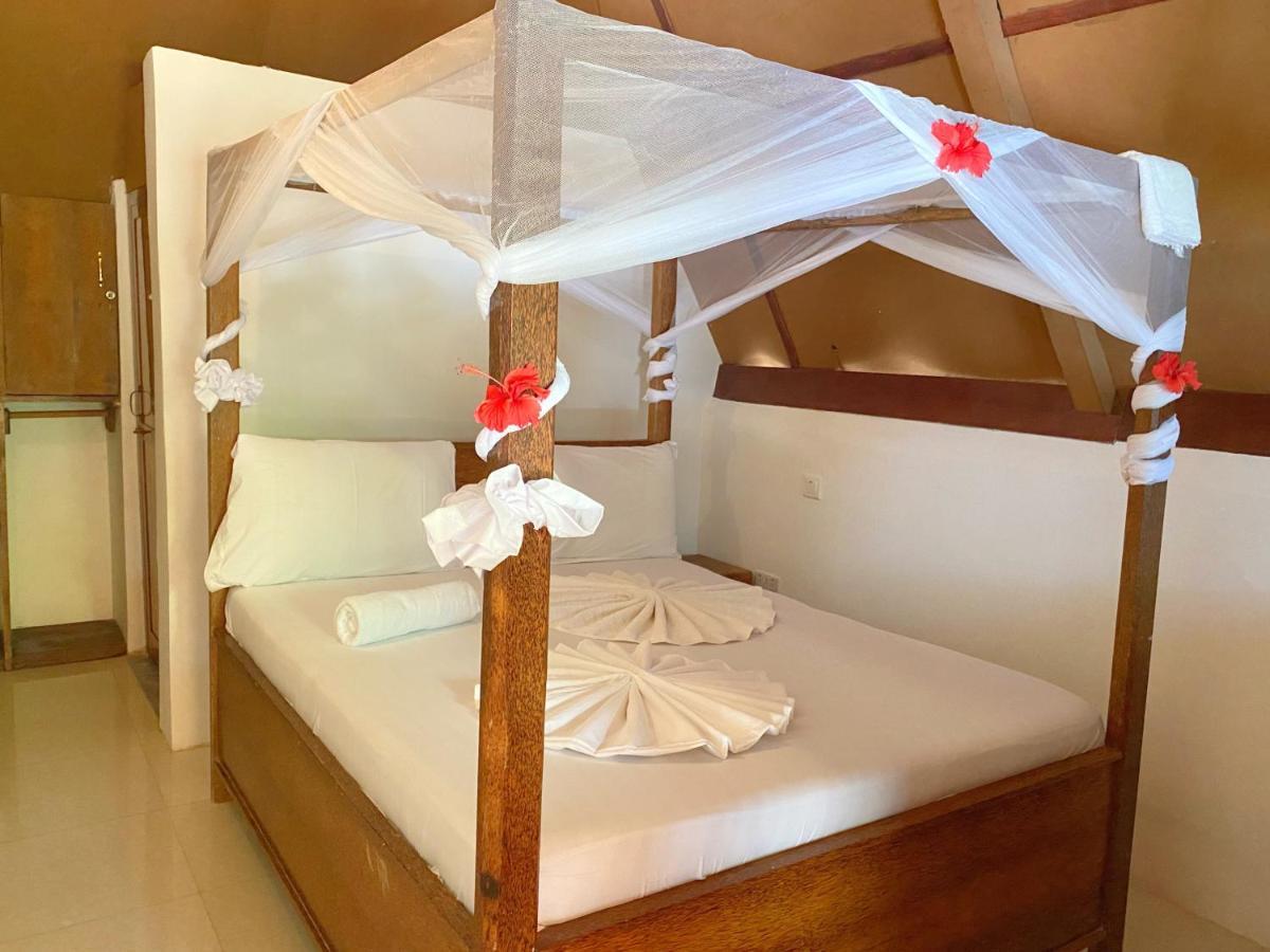 Utulivu Bungalow Нунгви Экстерьер фото